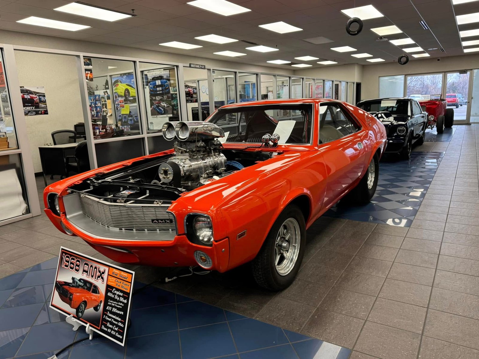 Orange classic car in a workshop